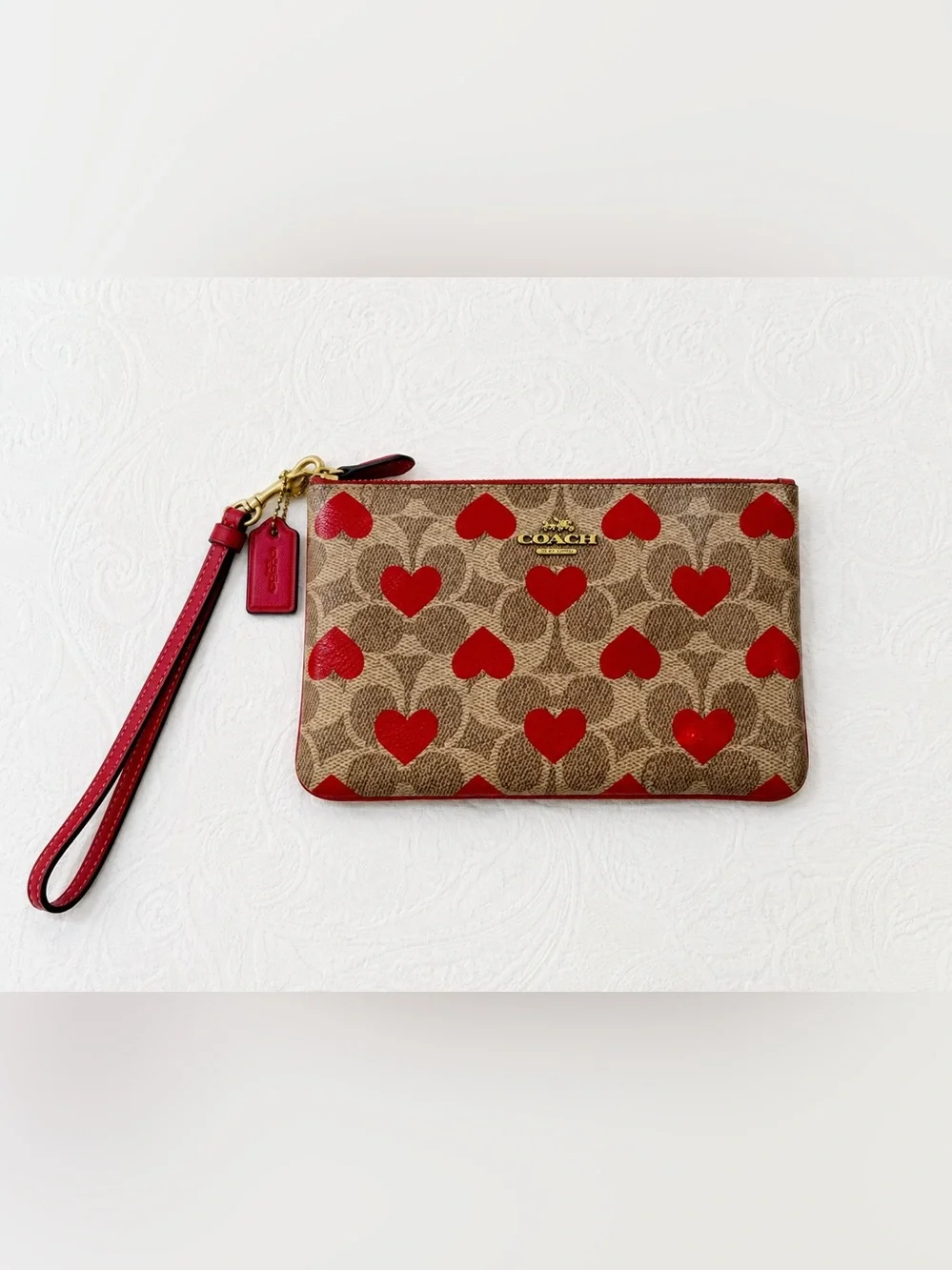 COACH Brown Signature Canvas Wristlet with Red Hearts